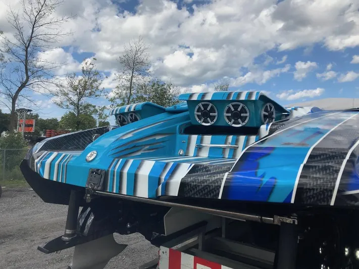  Yacht Photos Pics 2013 Nor-Tech 4000 Roadster boat with blue and white striped design.