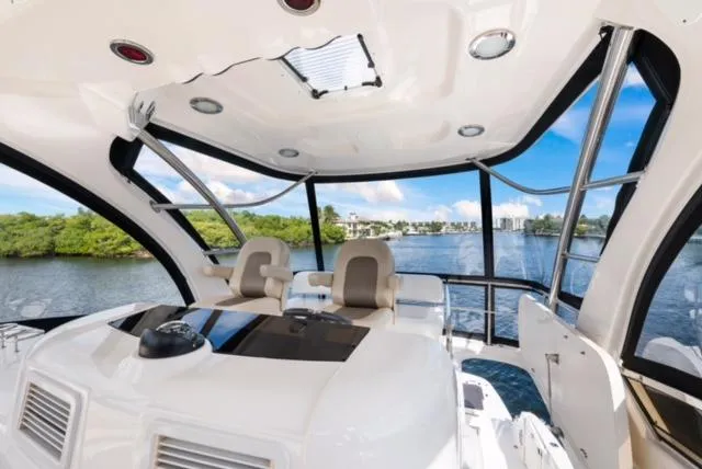 Exodus Yacht Photos Pics 2013 Sea Ray 520 Sedan Bridge interior with panoramic water view.
