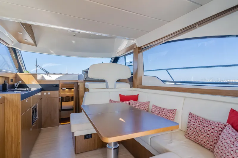 Special Place Yacht Photos Pics Luxurious interior of 2019 Bavaria Virtess 420 yacht with modern kitchen and seating area.