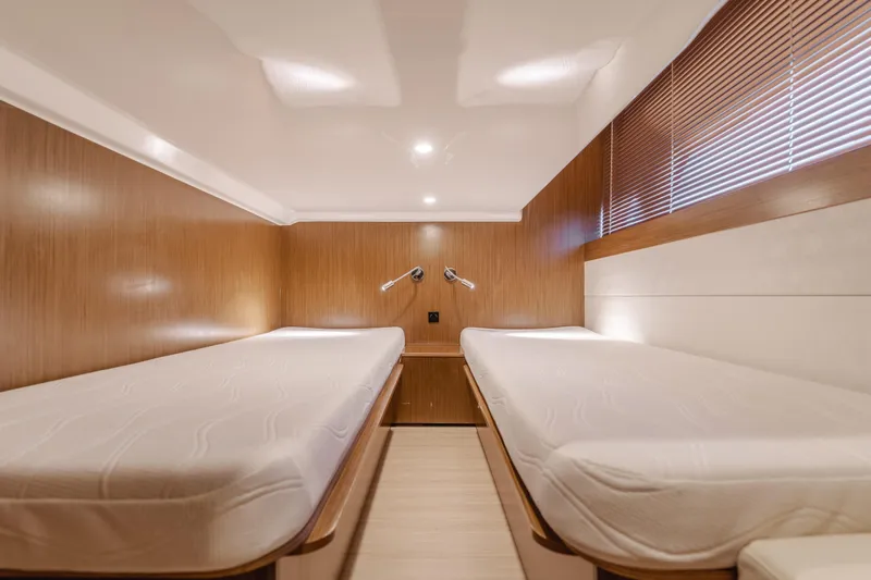 Special Place Yacht Photos Pics Interior cabin of 2019 Bavaria Virtess 420 yacht with twin beds and wooden paneling.