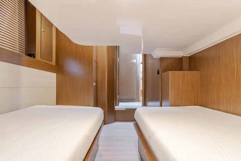 Special Place Yacht Photos Pics Interior cabin of 2019 Bavaria Virtess 420 yacht with twin beds and wooden finish.