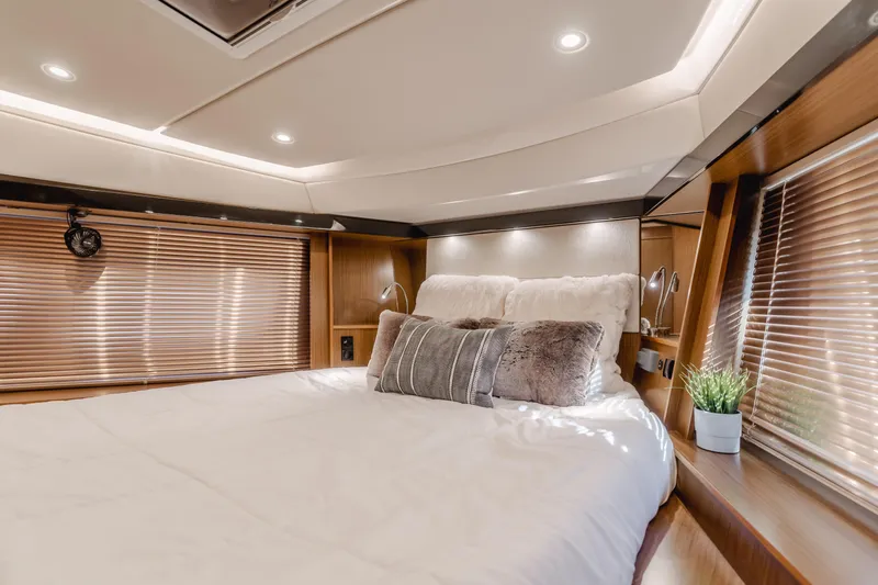 Special Place Yacht Photos Pics Luxurious bedroom interior of 2019 Bavaria Virtess 420 yacht with cozy bedding and elegant lighting.