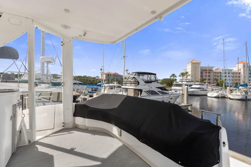 Bella Vita Yacht Photos Pics 2008 Meridian 408 Motoryacht docked at marina with scenic waterfront view.