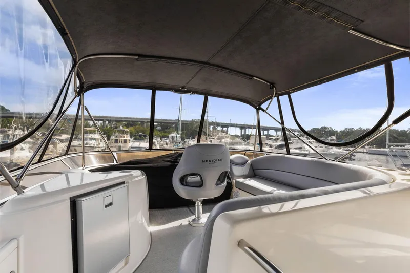 Bella Vita Yacht Photos Pics 2008 Meridian 408 Motoryacht interior with seating and marina view.