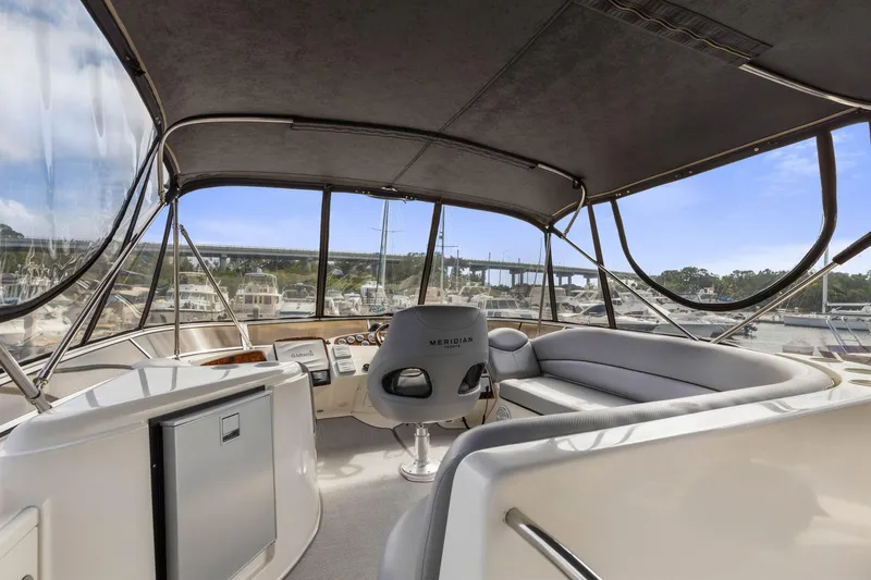Bella Vita Yacht Photos Pics 2008 Meridian 408 Motoryacht interior with helm, seating, and marina view.