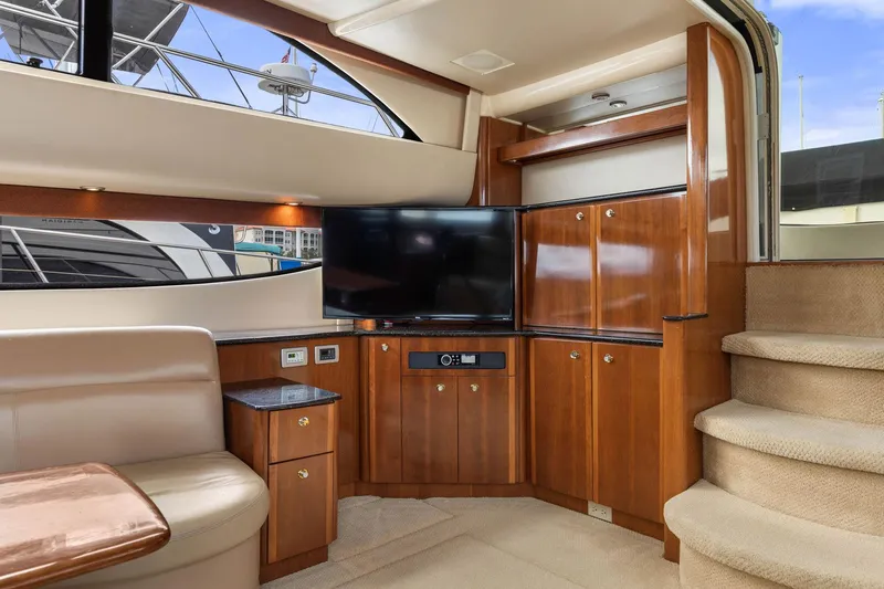 Bella Vita Yacht Photos Pics Luxurious interior of 2008 Meridian 408 Motoryacht with wood cabinetry and modern entertainment system.