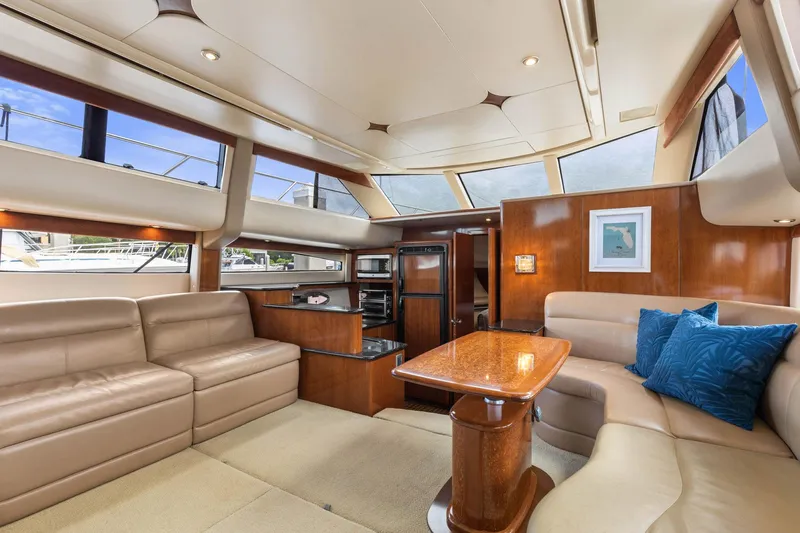 Bella Vita Yacht Photos Pics Luxurious interior of 2008 Meridian 408 Motoryacht with plush seating and elegant wood finishes.
