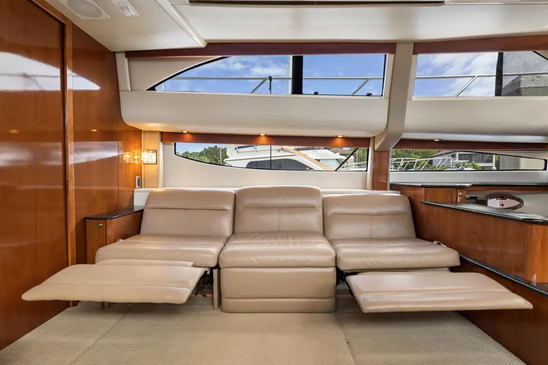 Bella Vita Yacht Photos Pics Luxurious interior of 2008 Meridian 408 Motoryacht with beige leather seating and wood accents.