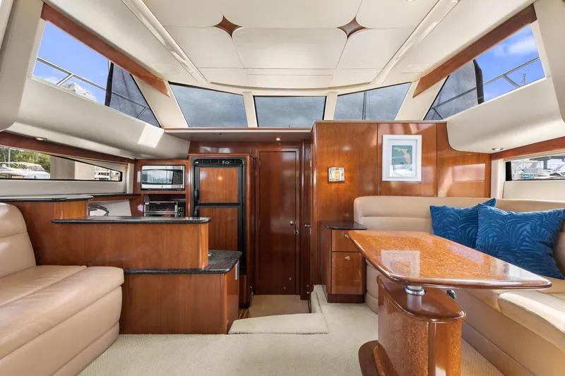 Bella Vita Yacht Photos Pics Luxurious interior of 2008 Meridian 408 Motoryacht with elegant wood finishes and plush seating.