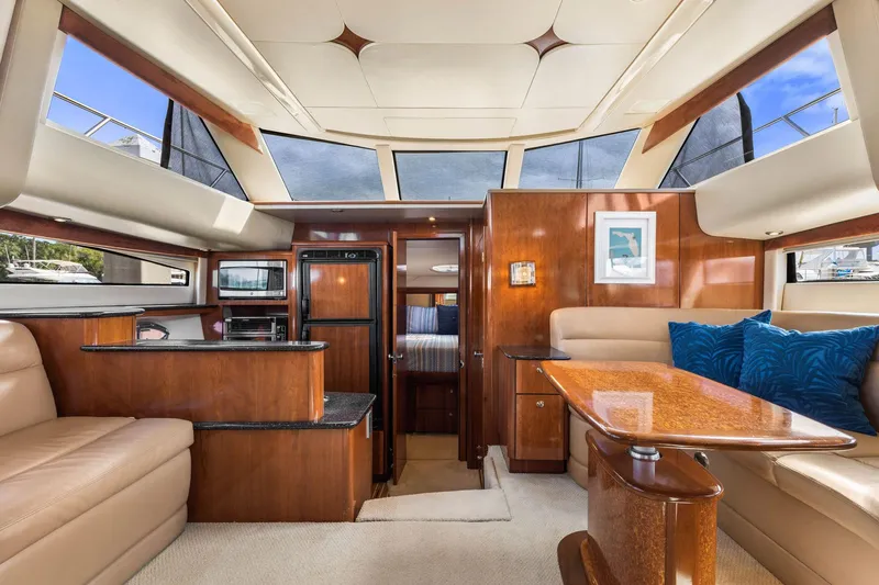 Bella Vita Yacht Photos Pics Luxurious interior of 2008 Meridian 408 Motoryacht with elegant wood finishes and plush seating.