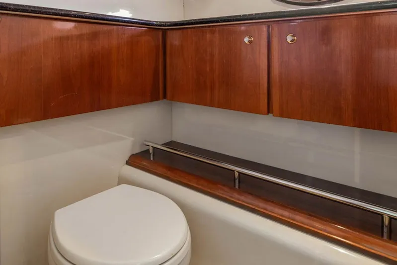 Bella Vita Yacht Photos Pics Luxurious bathroom interior of 2008 Meridian 408 Motoryacht with wooden cabinetry.