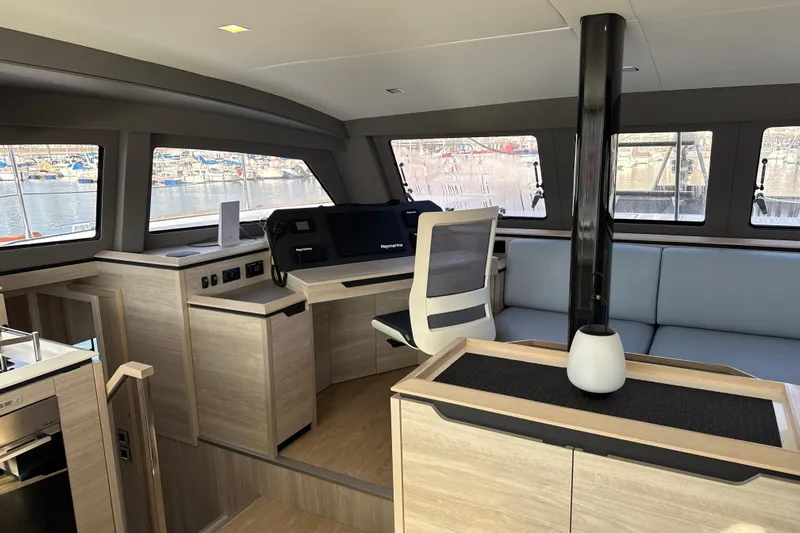 Alter Ego Yacht Photos Pics Luxurious interior of 2023 Catana 50 Ocean Class yacht with modern navigation station.
