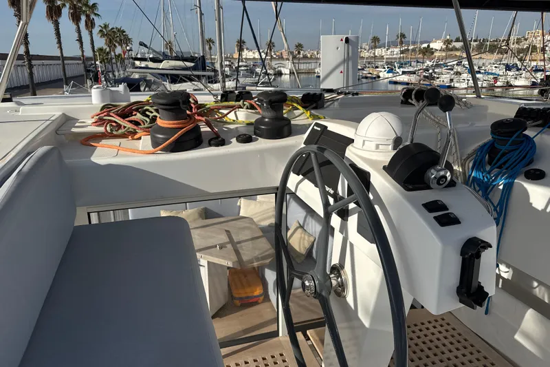 Alter Ego Yacht Photos Pics Helm of 2023 Catana 50 Ocean Class yacht with ropes and controls in marina.