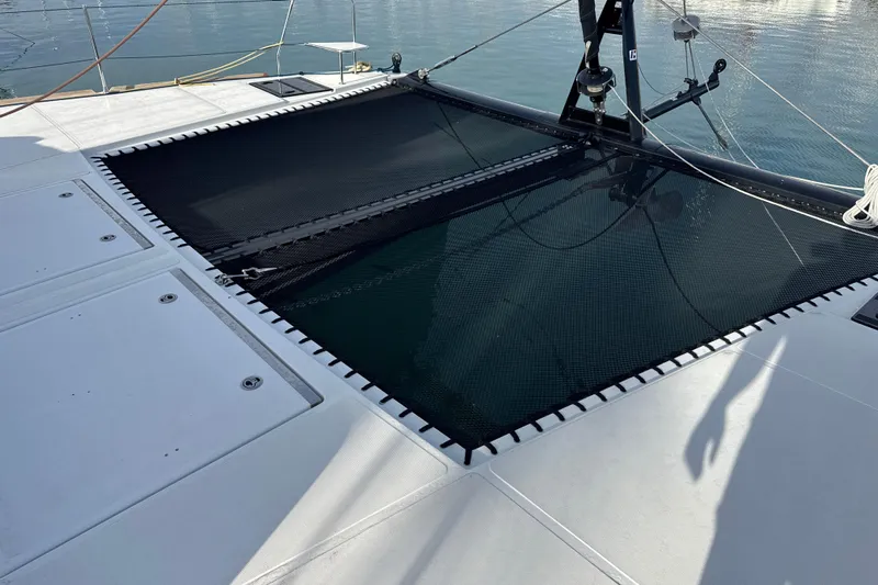 Alter Ego Yacht Photos Pics Catana 50 Ocean Class 2023 catamaran deck with netting over calm water.