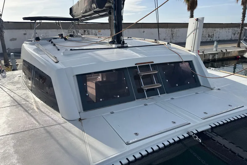 Alter Ego Yacht Photos Pics 2023 Catana 50 Ocean Class catamaran docked, showcasing sleek design and spacious deck.