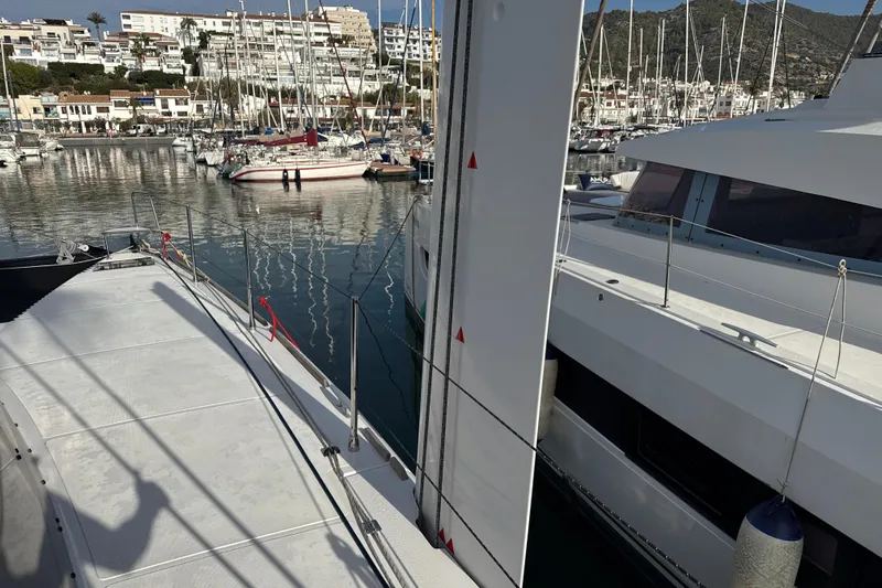 Alter Ego Yacht Photos Pics 2023 Catana 50 Ocean Class yacht docked in a marina with surrounding boats.
