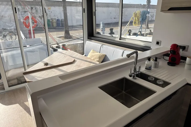 Alter Ego Yacht Photos Pics Modern kitchen interior on 2023 Catana 50 Ocean Class yacht, featuring sleek design and ample natural light.