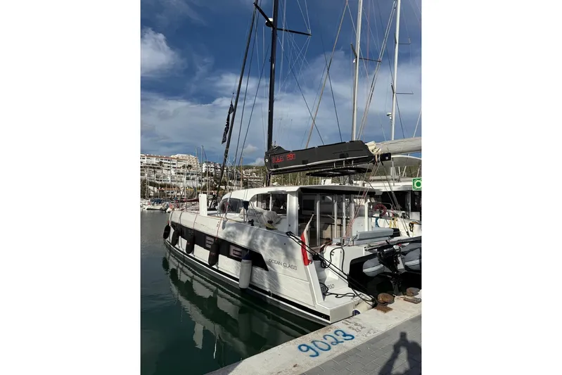 Alter Ego Yacht Photos Pics 2023 Catana 52 Ocean Class yacht docked in a marina under a clear sky.