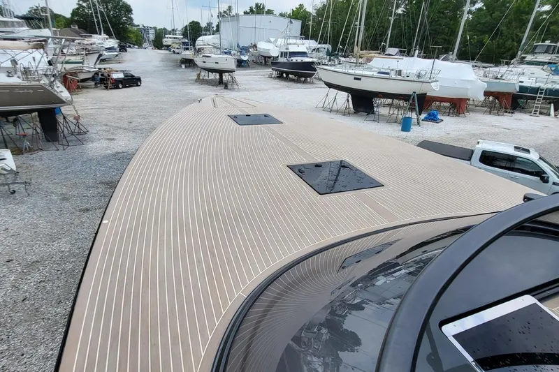  Yacht Photos Pics 2023 VanDutch 56 yacht in a boatyard, showcasing sleek deck design.