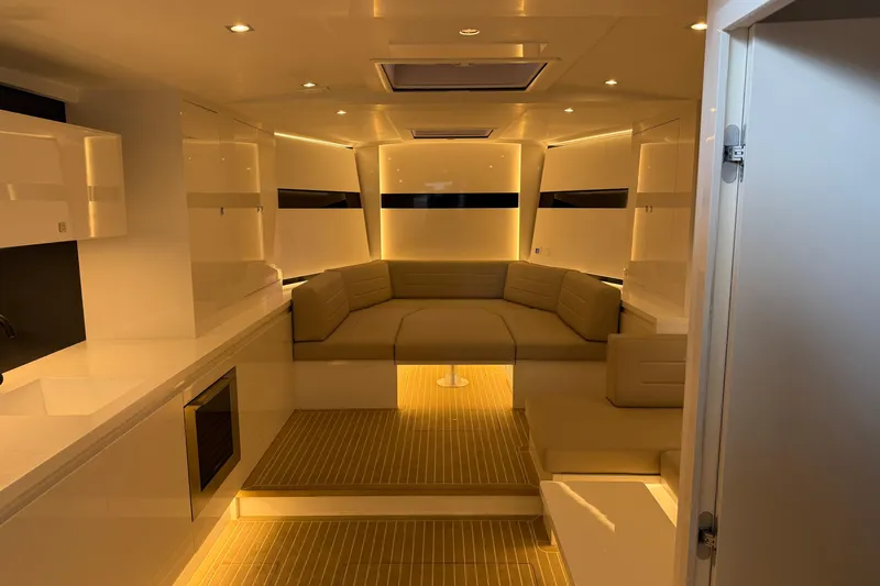  Yacht Photos Pics Luxurious interior of 2023 VanDutch 56 yacht with modern seating and ambient lighting.