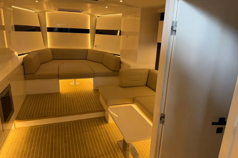  Yacht Photos Pics Luxurious interior of 2023 VanDutch 56 yacht with elegant seating and ambient lighting.