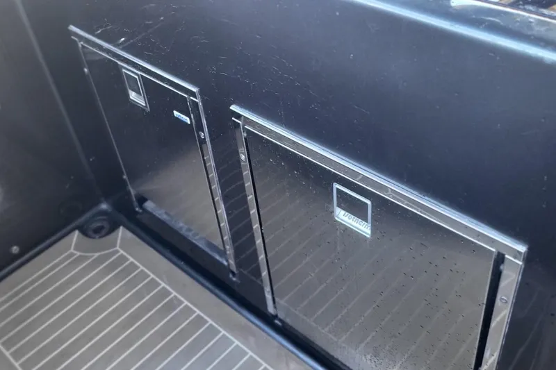  Yacht Photos Pics VanDutch 56 yacht interior storage compartments, 2023 model, featuring sleek black design.