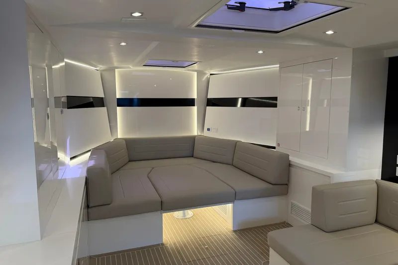  Yacht Photos Pics Luxurious interior of 2023 VanDutch 56 yacht with modern seating and ambient lighting.