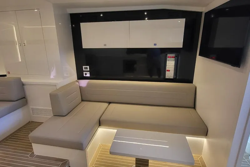 Yacht Photos Pics Luxurious interior of 2023 VanDutch 56 yacht with modern seating and sleek design.