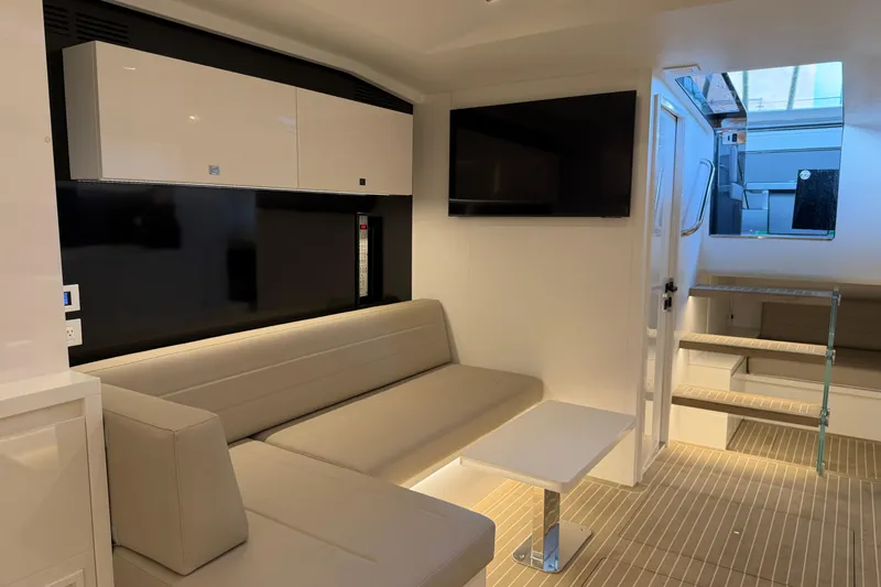  Yacht Photos Pics Luxurious interior of 2023 VanDutch 56 yacht with modern seating and sleek design.