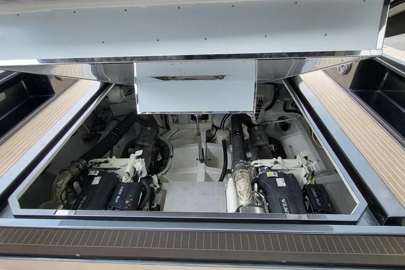  Yacht Photos Pics Engine compartment of 2023 VanDutch 56 yacht, showcasing dual engines and mechanical components.