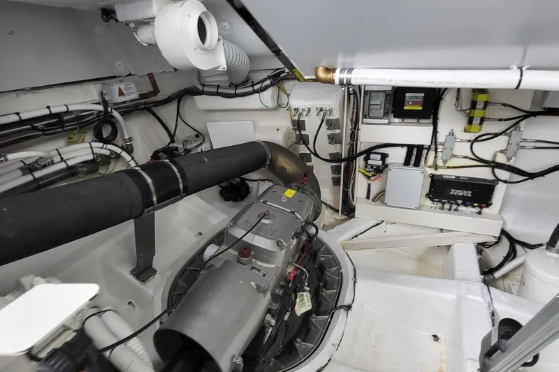  Yacht Photos Pics Engine room of 2023 VanDutch 56 yacht, showcasing mechanical components and wiring.