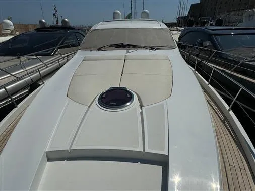  Yacht Photos Pics 2008 Pershing 64' yacht docked at a marina.