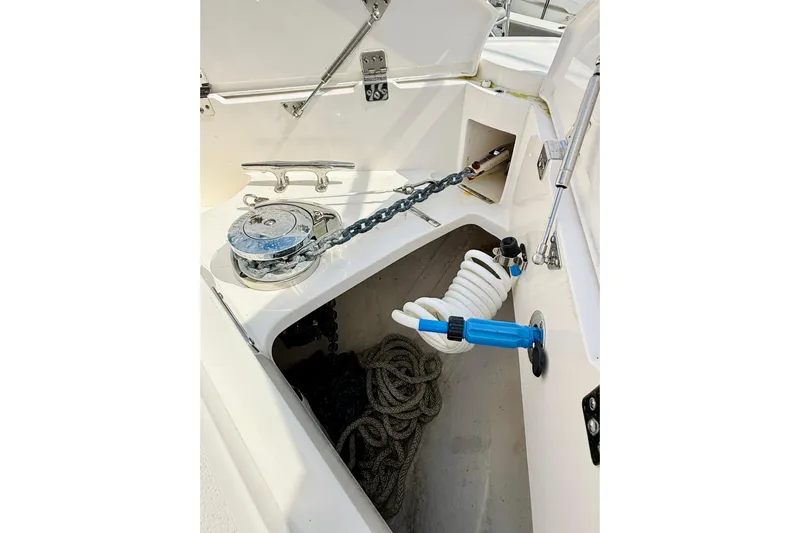  Yacht Photos Pics Anchor compartment of 2021 Intrepid 410 Evolution boat with chain and coiled hose.
