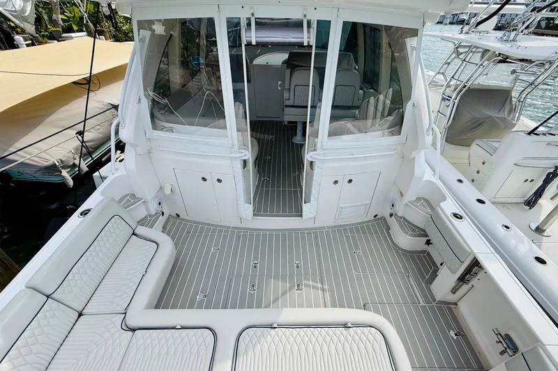  Yacht Photos Pics 2021 Intrepid 410 Evolution boat interior with sleek seating and modern design.