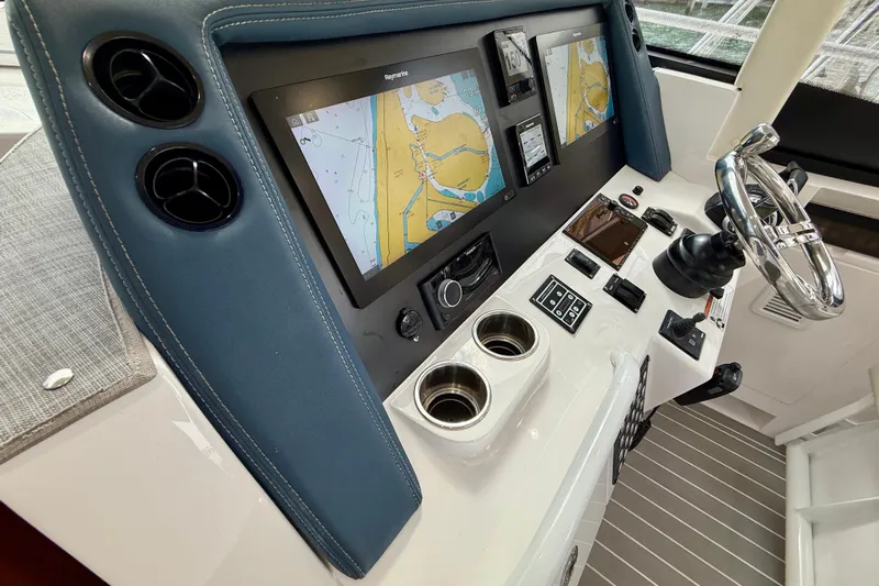  Yacht Photos Pics Intrepid 410 Evolution 2021 helm with navigation screens and controls.