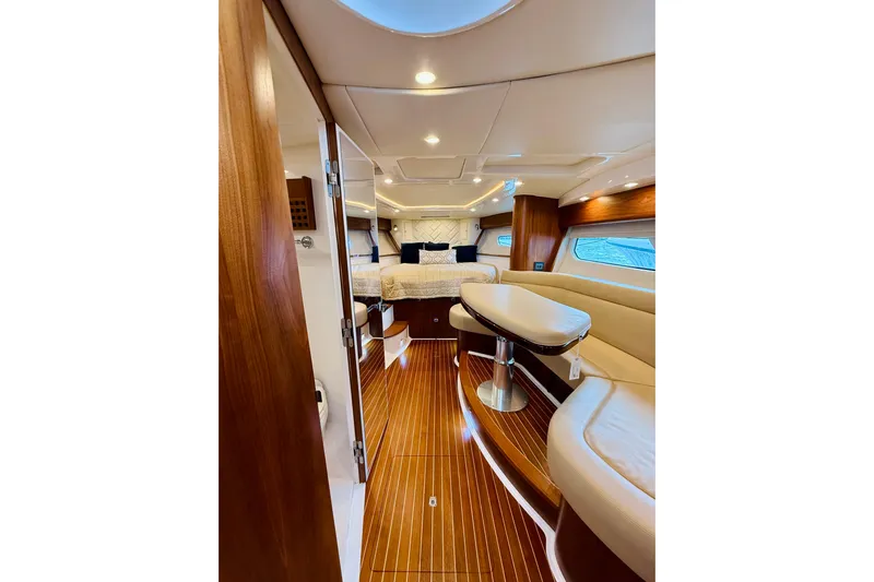  Yacht Photos Pics Luxurious interior of 2021 Intrepid 410 Evolution yacht with elegant wood finishes.