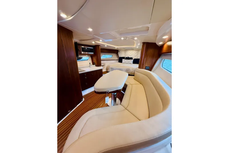  Yacht Photos Pics Luxurious interior of 2021 Intrepid 410 Evolution yacht with elegant seating and modern amenities.