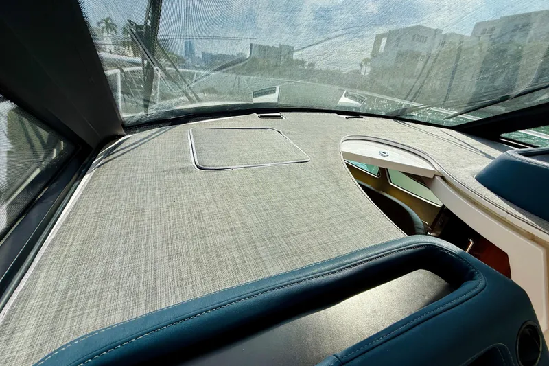  Yacht Photos Pics Interior view of 2021 Intrepid 410 Evolution yacht dashboard with sleek design and modern features.