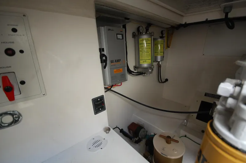  Yacht Photos Pics Engine room of 2001 Cabo 35 Express boat with electrical panel and equipment.