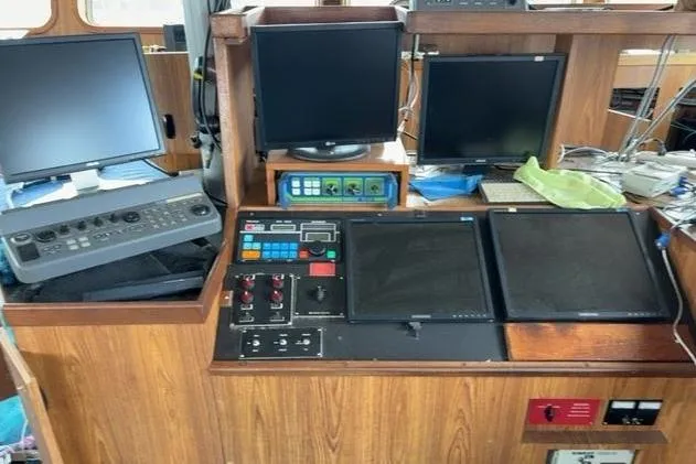  Yacht Photos Pics Control panel of a 1976 Halter Custom Built Mid-Water Trawler with multiple screens and instruments.