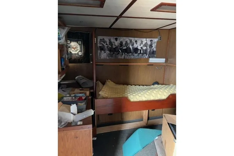  Yacht Photos Pics Interior of a 1976 Halter Custom Built Mid-Water Trawler, featuring a bunk bed and storage.