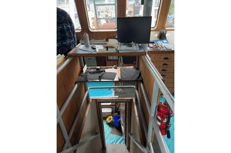  Yacht Photos Pics Interior of 1976 Halter Custom Built Mid-Water Trawler, featuring control room and equipment.
