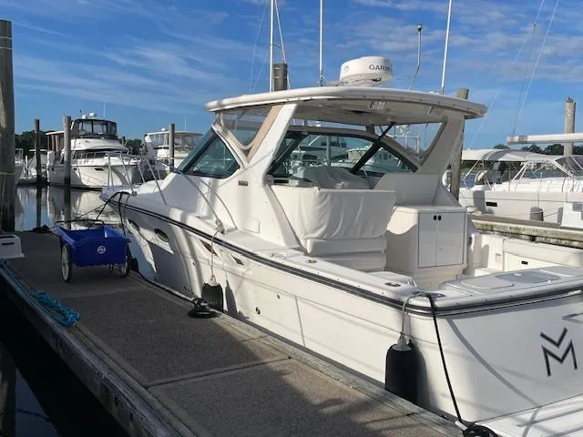 Mae Yacht Photos Pics 2005 Tiara Yachts 3200 docked at marina under clear blue sky.
