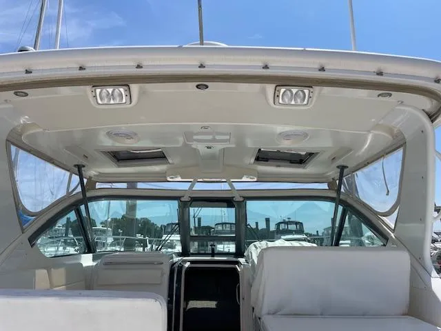 Mae Yacht Photos Pics 2005 Tiara Yachts 3200 interior view with seating and windows, docked at marina.