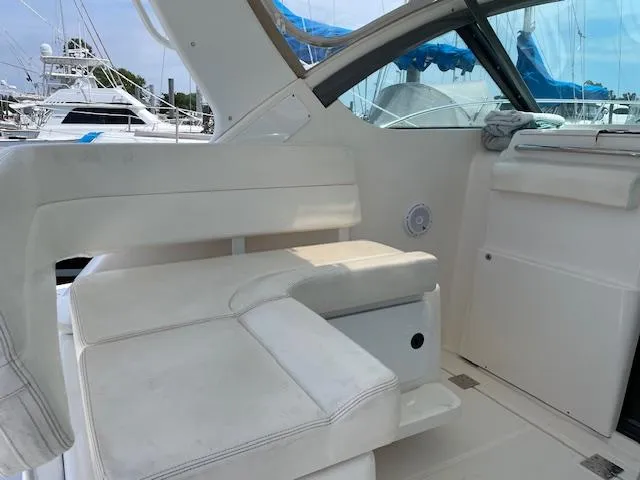 Mae Yacht Photos Pics 2005 Tiara Yachts 3200 interior with white seating and sleek design.