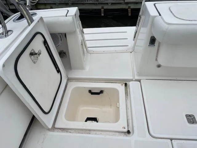 Mae Yacht Photos Pics 2005 Tiara Yachts 3200 deck with open storage compartment and seating area.