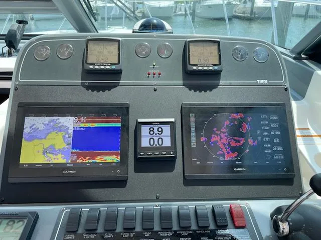 Mae Yacht Photos Pics Dashboard of a 2005 Tiara Yachts 3200 with Garmin navigation displays.