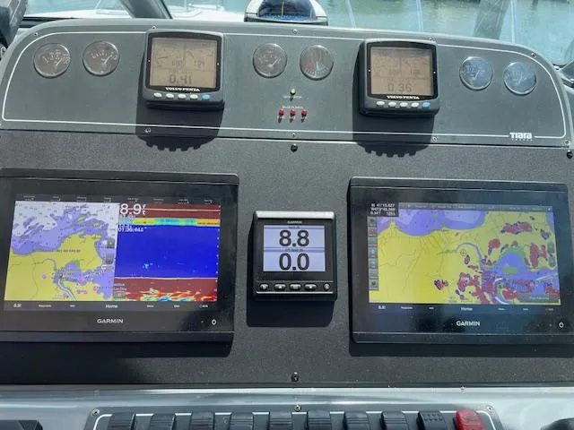 Mae Yacht Photos Pics Dashboard of a 2005 Tiara Yachts 3200 with Garmin navigation displays.