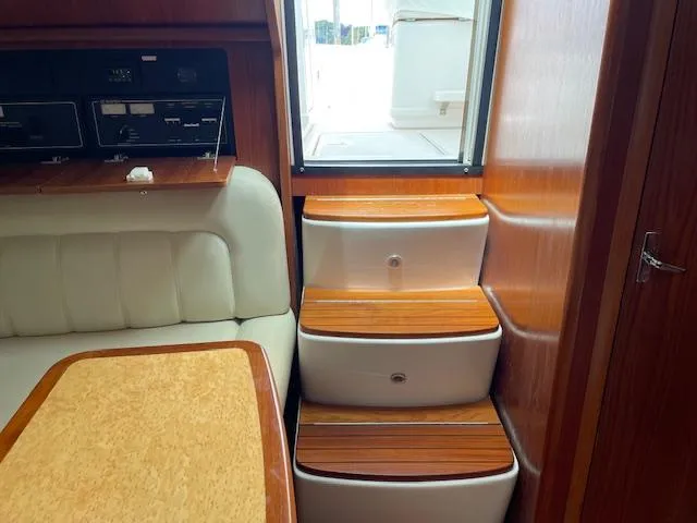 Mae Yacht Photos Pics Interior of 2005 Tiara Yachts 3200, featuring wooden steps and seating area.