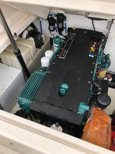 Mae Yacht Photos Pics Engine compartment of a 2005 Tiara Yachts 3200, showcasing a well-maintained marine engine.